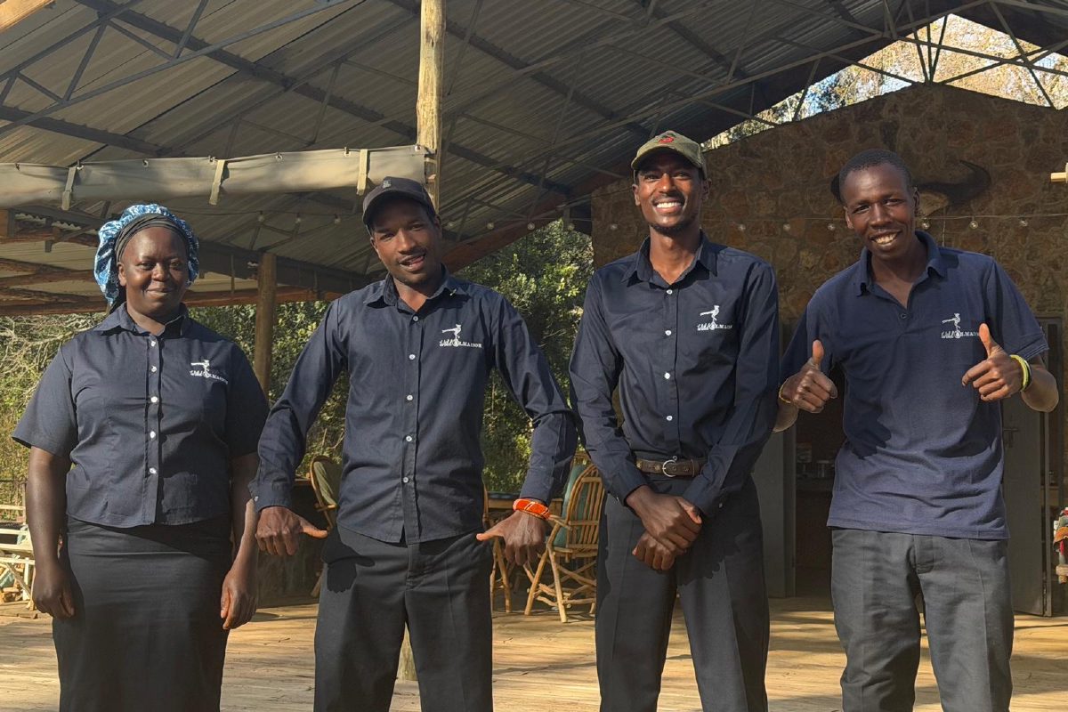 Richard, Mwangi, Nick and Regina standing together at Ol Maisor Camp, right to left.